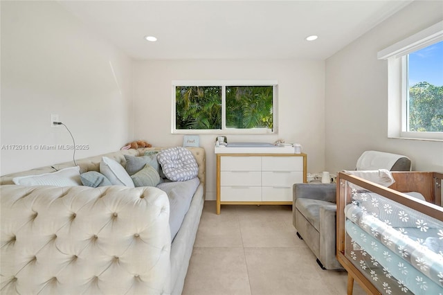 bedroom with light tile patterned floors