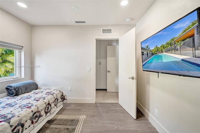 bedroom featuring wood-type flooring