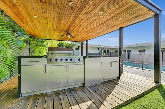 deck with area for grilling and ceiling fan