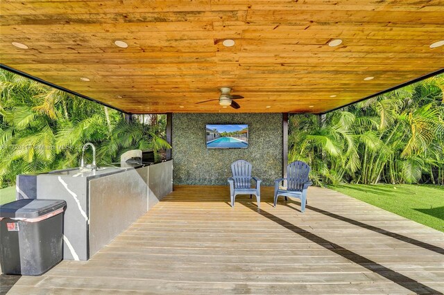 view of patio / terrace featuring area for grilling, ceiling fan, and a deck