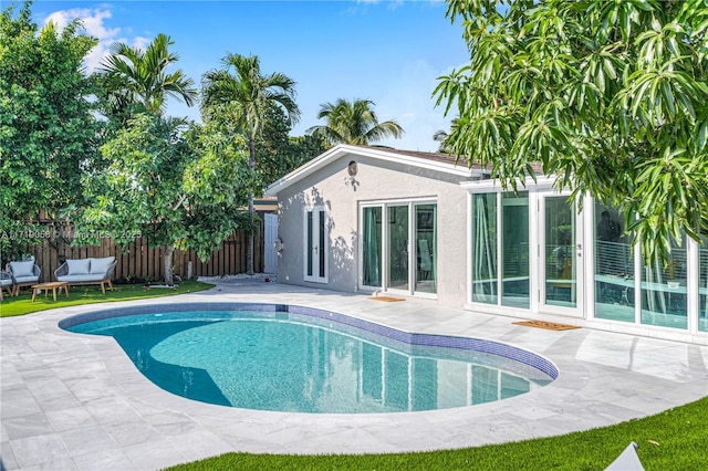 view of pool featuring a patio