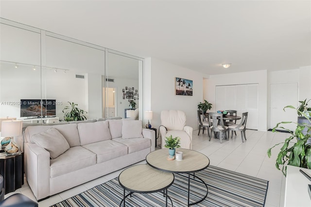 living room featuring light tile patterned floors