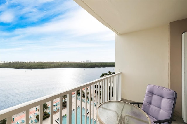 balcony featuring a water view