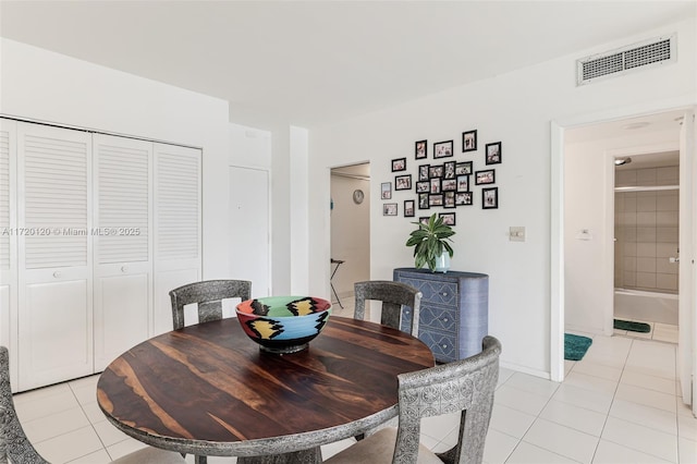 dining area with light tile patterned floors