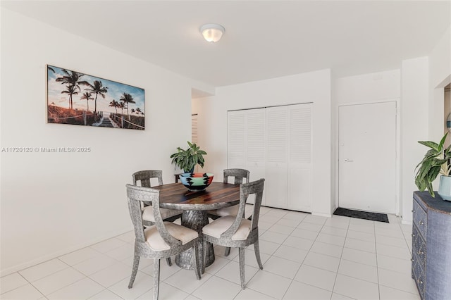 dining area with light tile patterned flooring