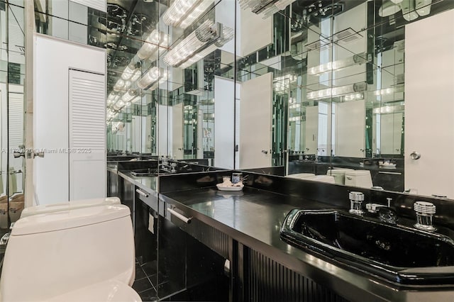 bathroom featuring vanity and toilet