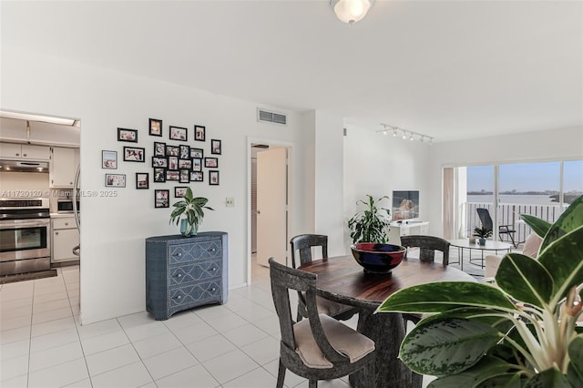 dining room with light tile patterned flooring