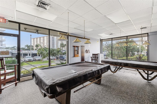 rec room featuring carpet flooring, a wall of windows, and billiards