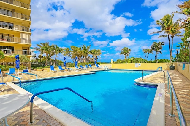 view of swimming pool with a patio area