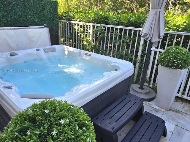 view of patio / terrace featuring a hot tub