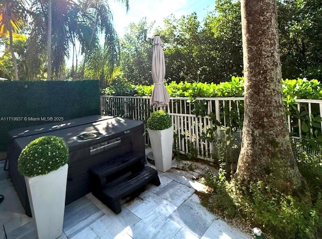 view of patio with a hot tub