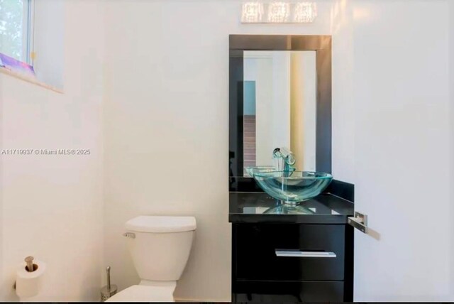 bathroom with vanity and toilet