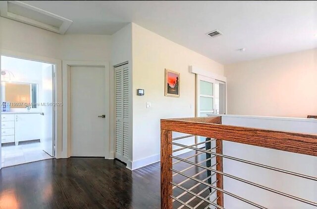 hallway featuring dark hardwood / wood-style floors