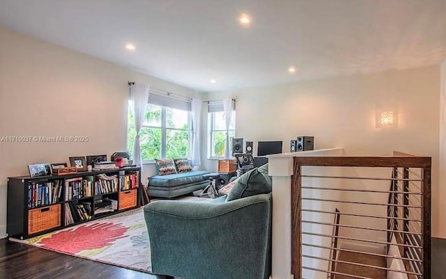 living area with wood finished floors and recessed lighting