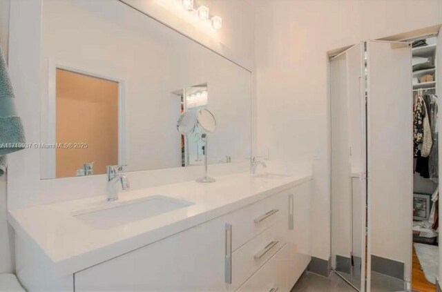 bathroom featuring vanity and walk in shower