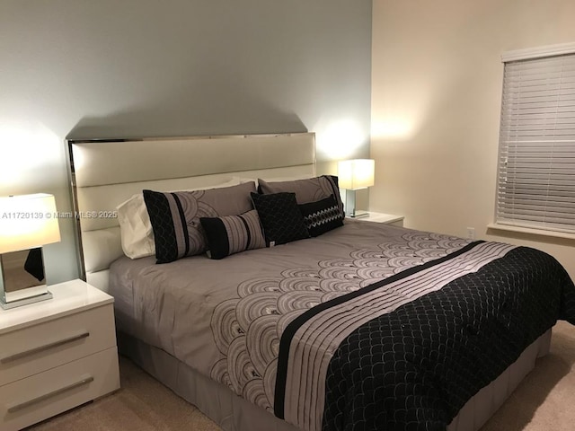 bedroom with light colored carpet