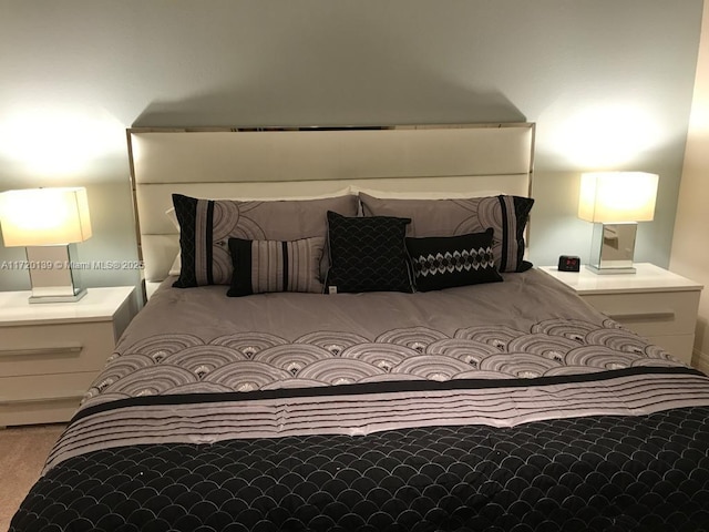 bedroom featuring light carpet