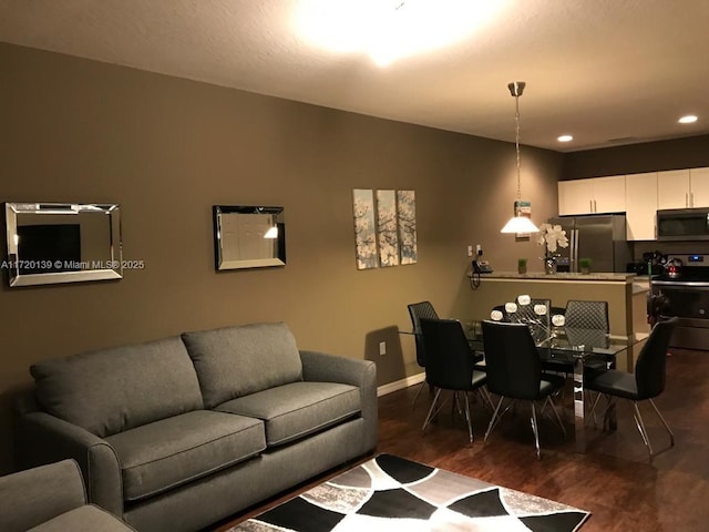 living room with dark hardwood / wood-style floors