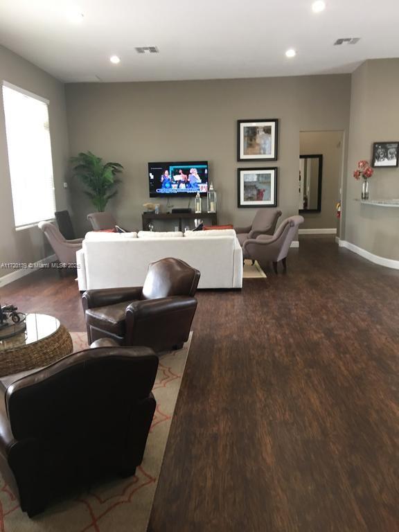 living room with dark hardwood / wood-style floors