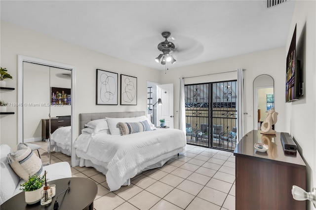 bedroom with access to outside, ceiling fan, and light tile patterned flooring