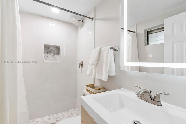 bathroom with a shower with curtain, vanity, and toilet