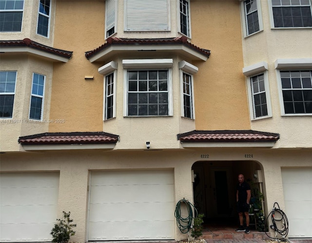 view of side of home with a garage