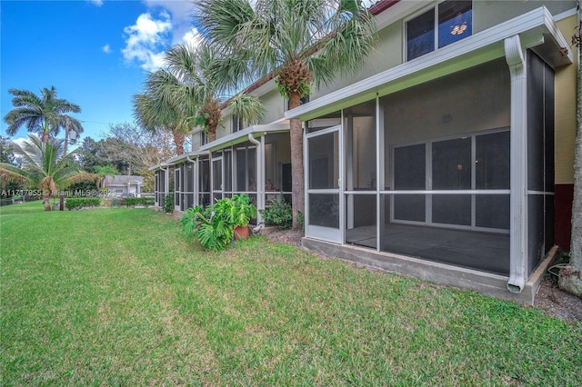 view of yard with a sunroom