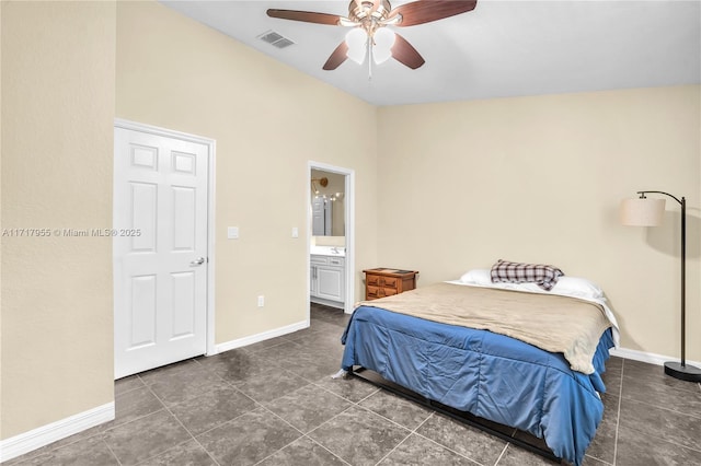 bedroom featuring ceiling fan, connected bathroom, and dark tile patterned flooring