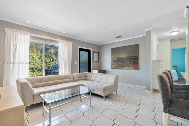 living room featuring ornamental molding, visible vents, and light tile patterned floors