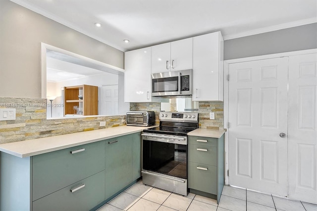 kitchen featuring white cabinetry, light countertops, appliances with stainless steel finishes, tasteful backsplash, and crown molding