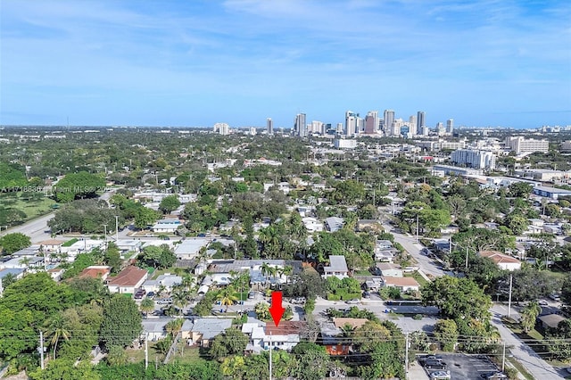 birds eye view of property with a view of city