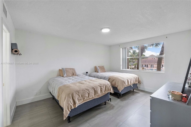 bedroom featuring a textured ceiling