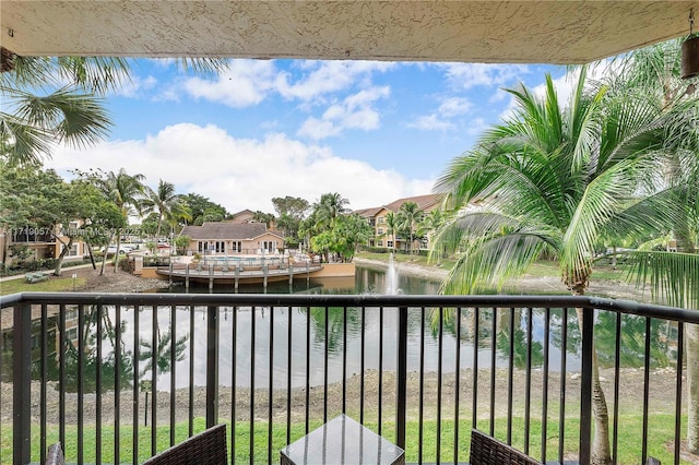 balcony featuring a water view