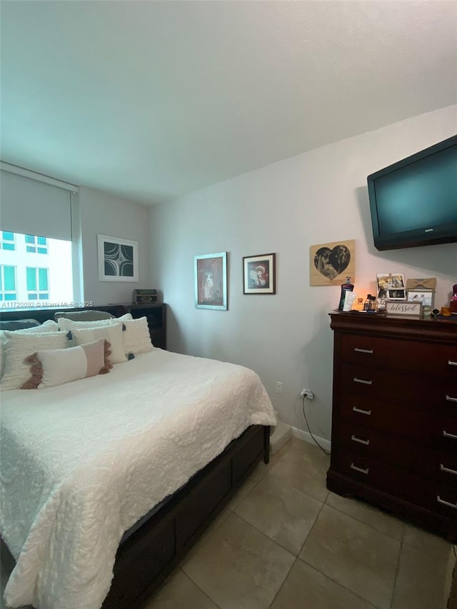 bedroom with light tile patterned floors