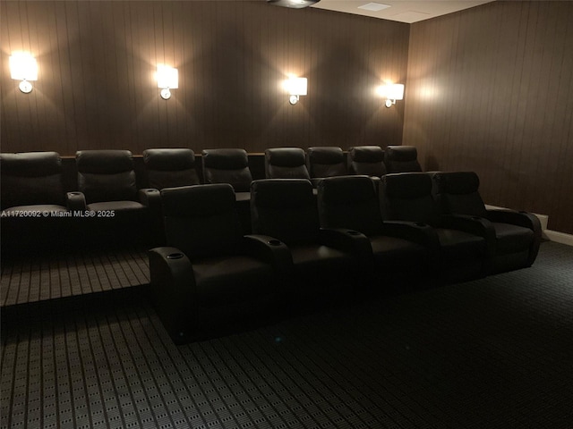 cinema with wooden walls and carpet floors