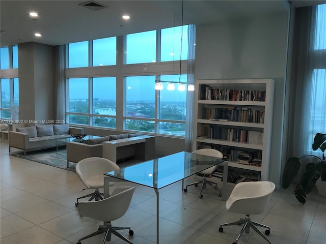 office featuring built in features and light tile patterned floors