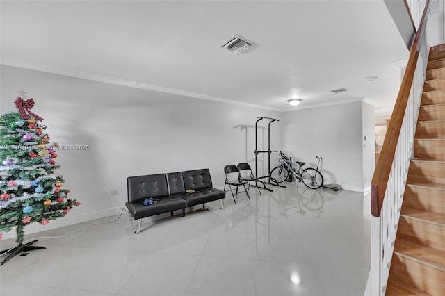 exercise room with light tile patterned floors and crown molding