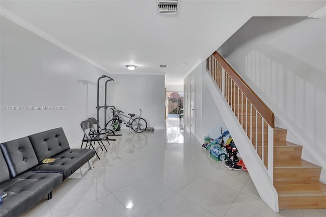 workout area featuring light tile patterned flooring and crown molding