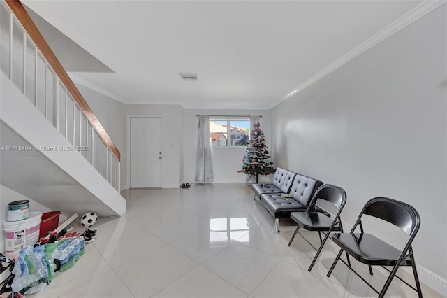 interior space with ornamental molding and light tile patterned floors