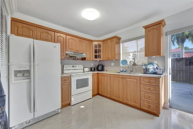 kitchen featuring white appliances, light tile patterned floors, crown molding, and sink