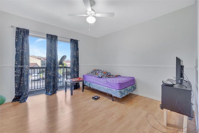 bedroom with ceiling fan and hardwood / wood-style floors