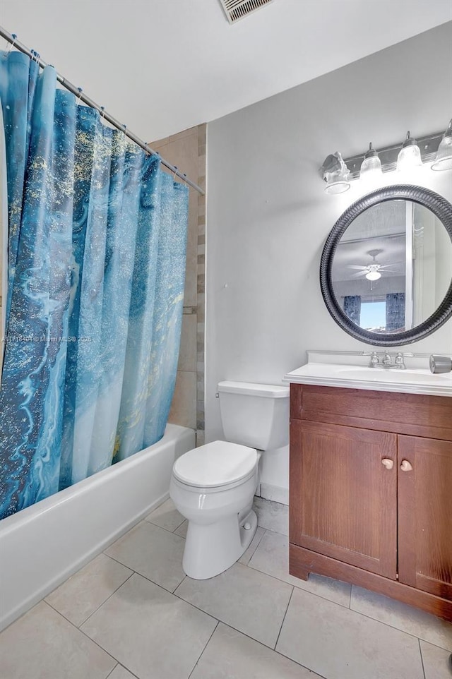 full bathroom featuring toilet, shower / bathtub combination with curtain, tile patterned floors, and vanity