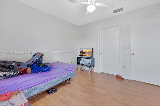 bedroom featuring hardwood / wood-style floors and ceiling fan