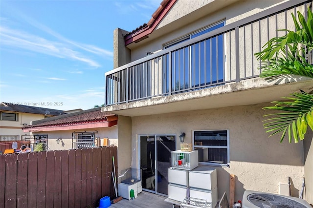 exterior space featuring a balcony and central AC unit