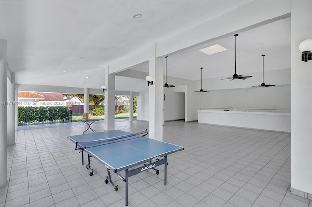 playroom featuring light tile patterned flooring and ceiling fan