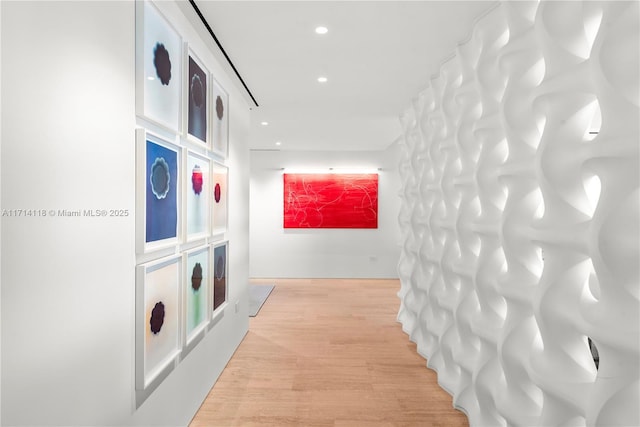 hallway with light hardwood / wood-style flooring