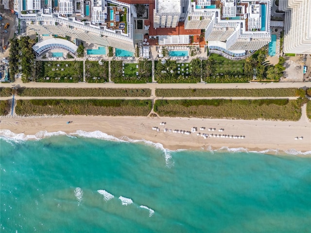 aerial view featuring a water view and a view of the beach