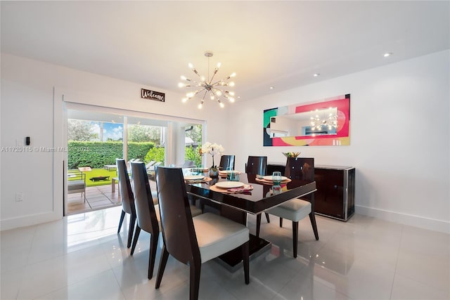 dining area with light tile patterned floors and a chandelier