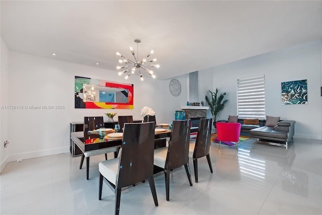 dining room with tile patterned flooring and an inviting chandelier