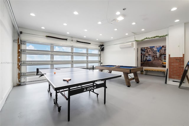 game room with an AC wall unit and pool table